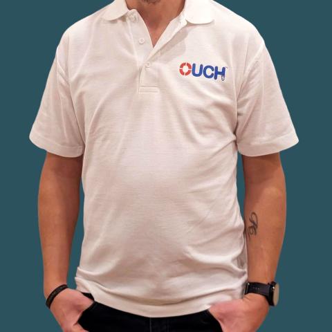 White polo shirt with OUCH(UK) logo